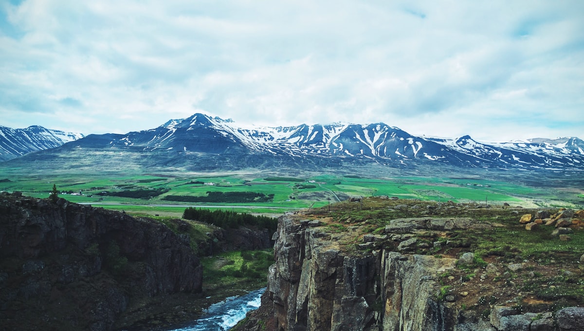 Iceland Ring Road cutting through volcanic lava field landscape under dramatic sky