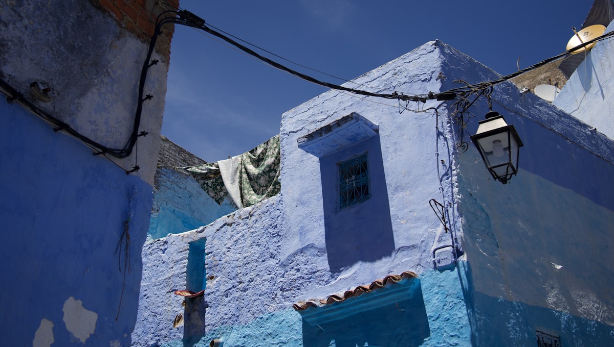 a blue and white building with a light on it