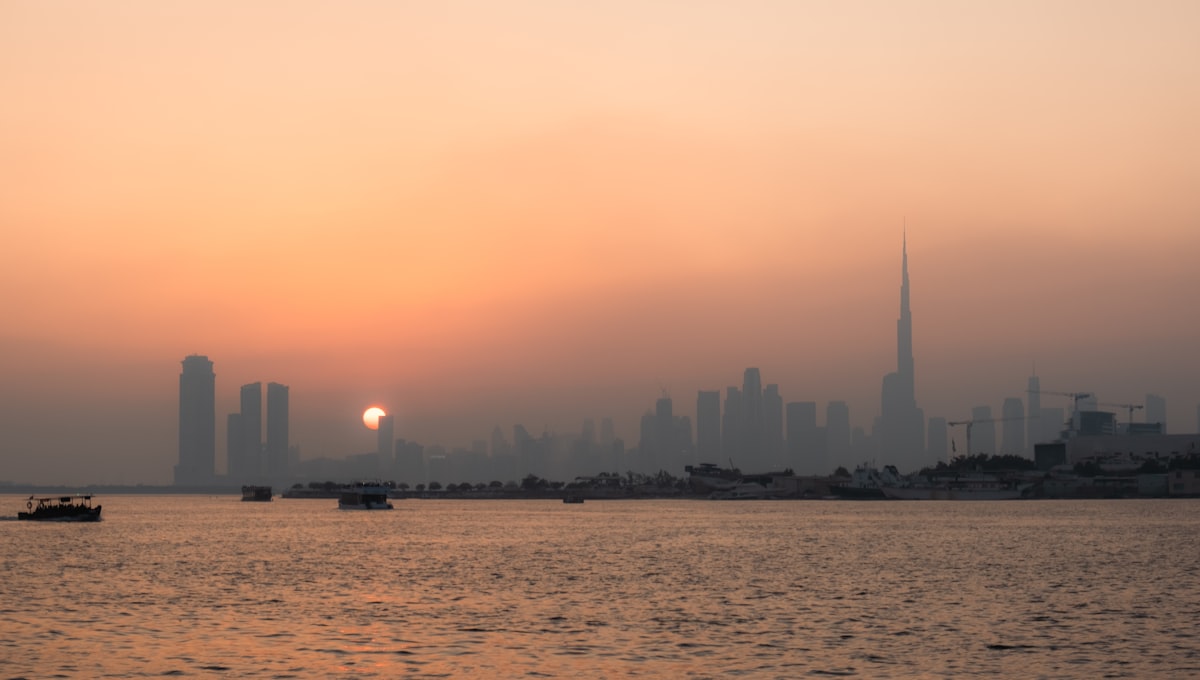Dubai skyline with the Burj Khalifa at dusk seen from across the water