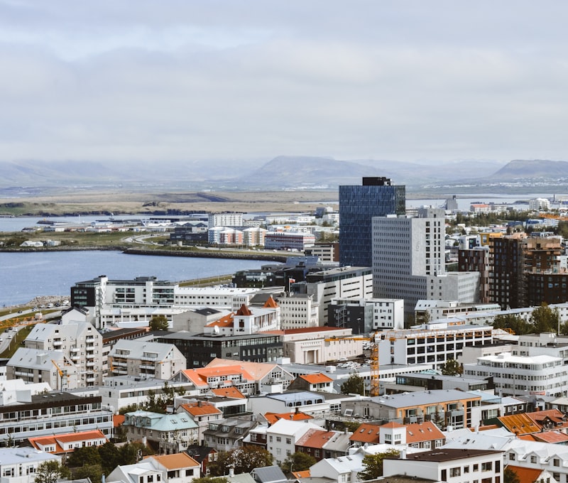 Reykjavik city skyline with the Hallgrímskirkja church and snow-capped mountains in the background