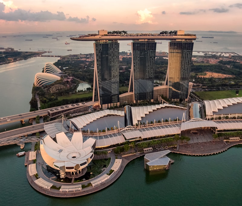Singapore's Marina Bay skyline at night with the Marina Bay Sands hotel and Gardens by the Bay