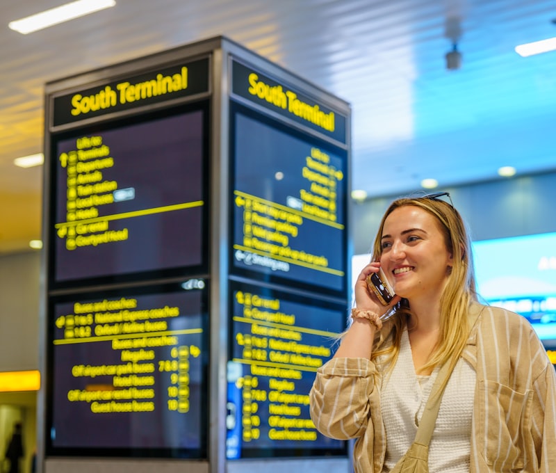 Passenger looking at departure board in a world-class airport hub during a stopover